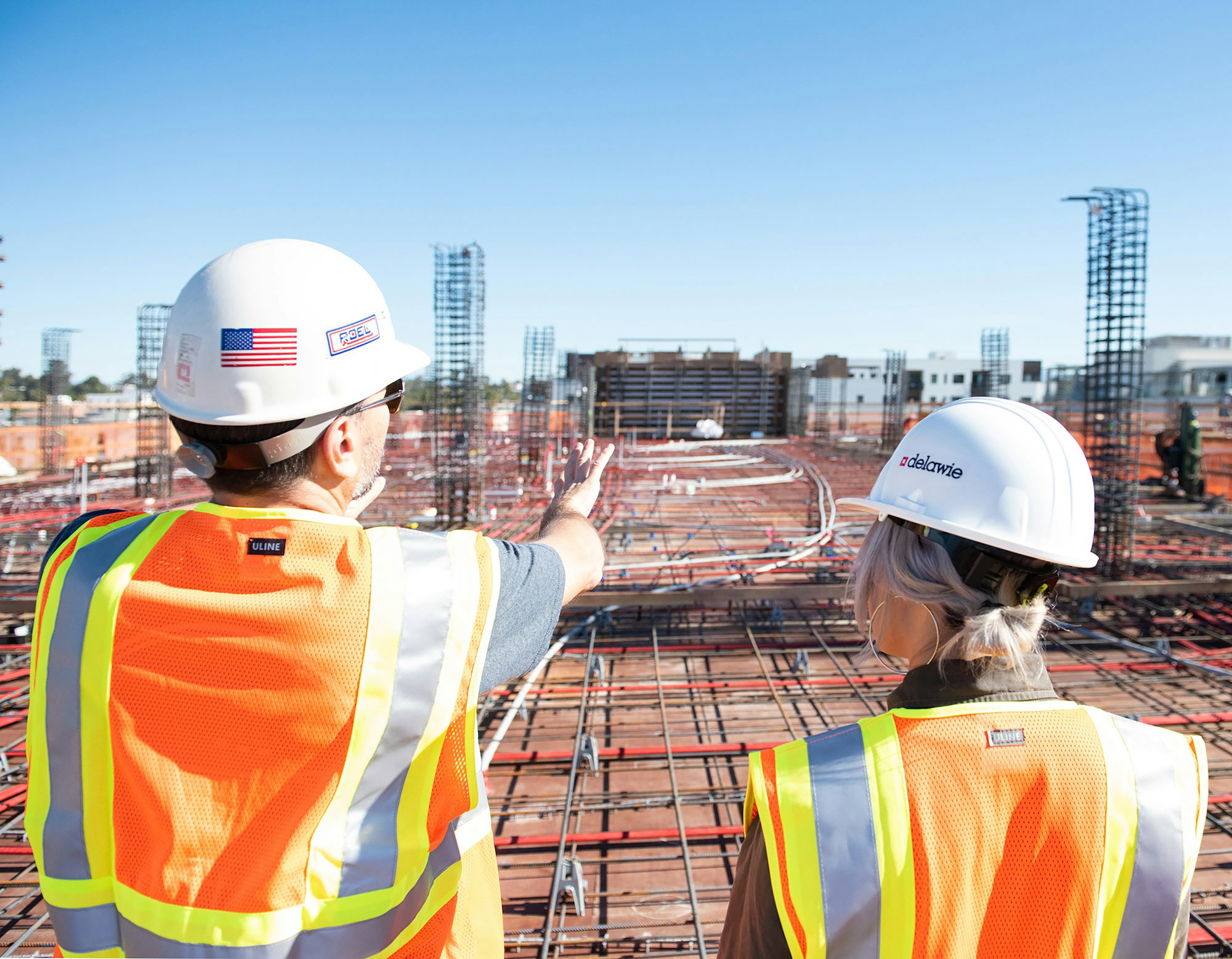 man-in-white-hard-hat-standing-on-brown-wooden-dock-during-daytime.jpg man in white hard hat standing on brown wooden dock during daytime